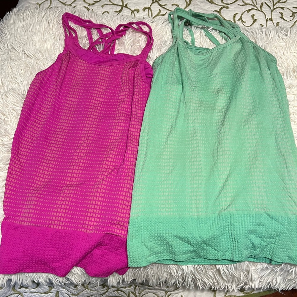TWO Athleta tanks size small built in supportive bra and crossed back. Lot